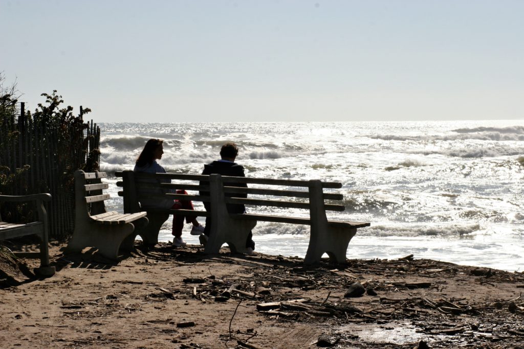 A Couple Sitting on the Beach in East Hampton