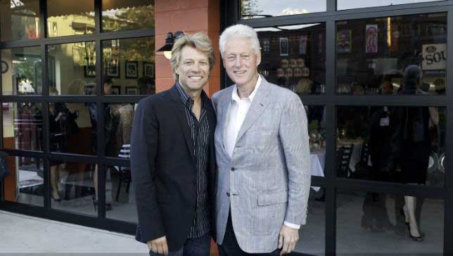 Image of Former president Bill Clinton visiting the JBJ Soul Kitchen and hanging out with the Jon Bon Jovi. (Photo: JBJ Soul Kitchen)
