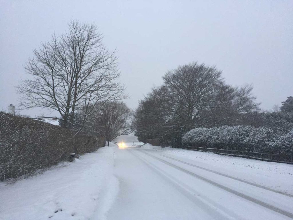 Egypt Lane in the Snow with Approaching Headlights