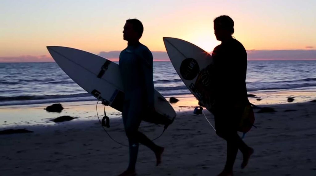 Kale Brock and Ryan Baohm with Surf Boards at Sunset