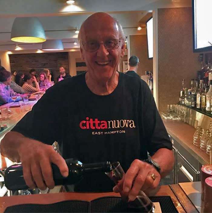 JJ Pouring a Quartino of Chianti Behind the Bar at Citta Nuova
